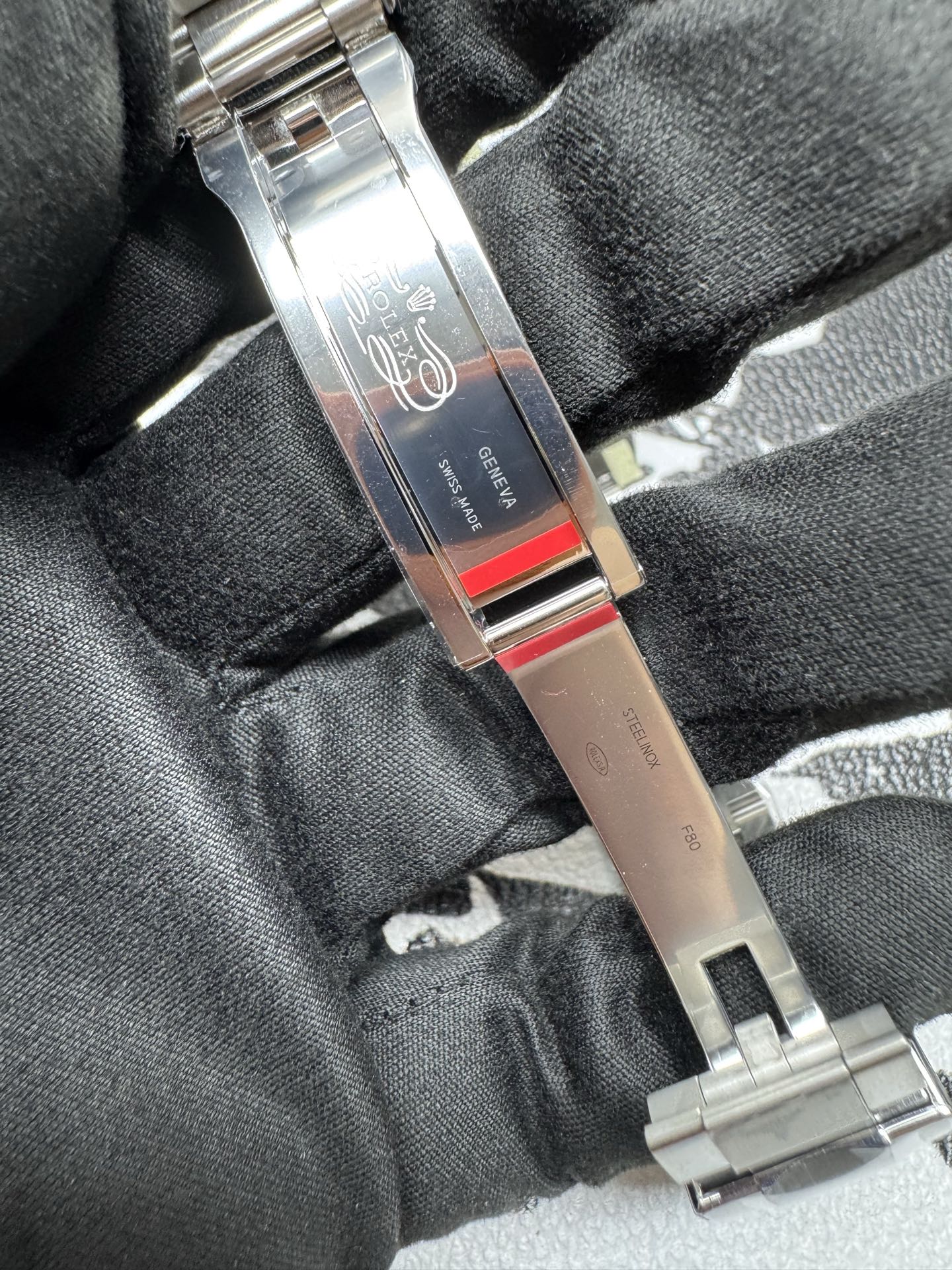 Replica Rolex clasp interior showing GENEVA and SWISS MADE engravings