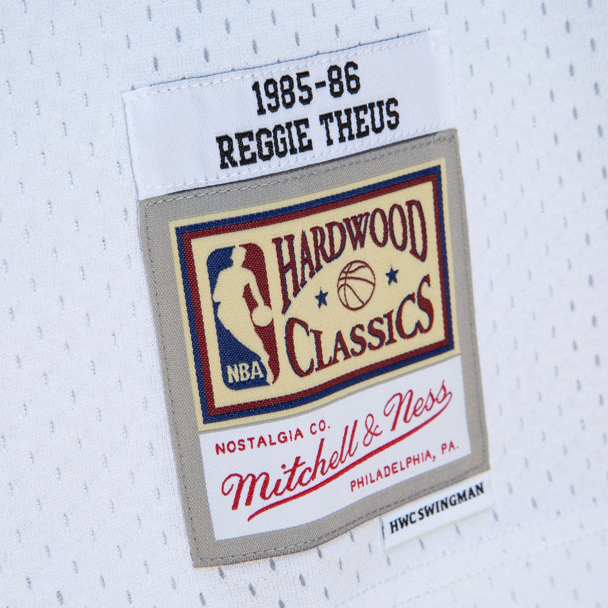 Reggie Theus Sacramento Kings Mitchell & Ness 1985\/86 Hardwood Classics Fadeaway Swingman Player Jersey - White\/Light Blue