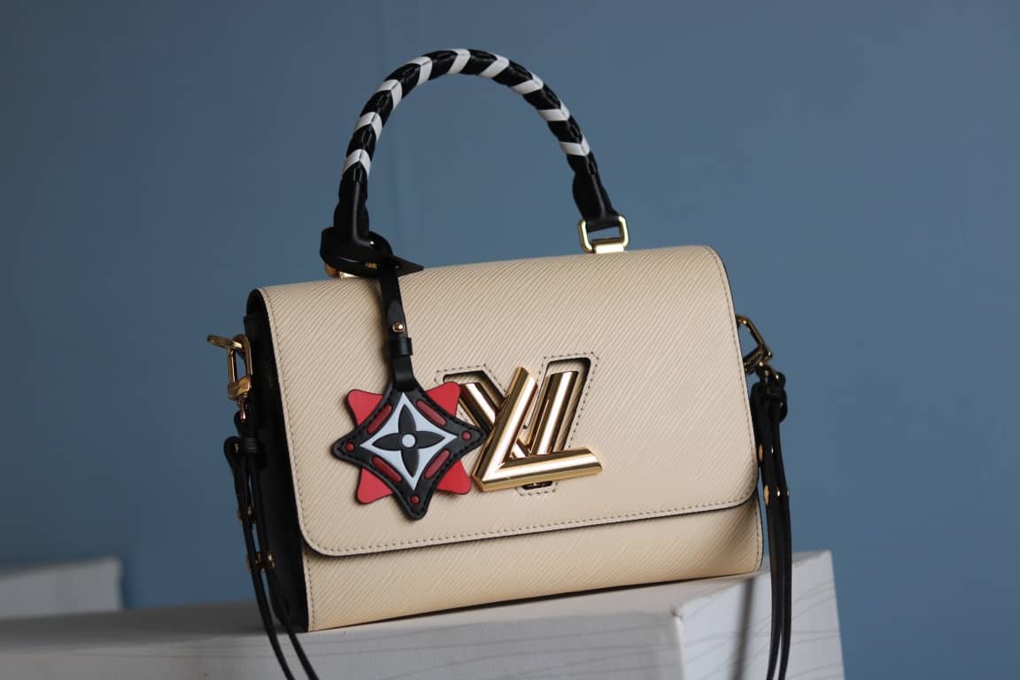 Louis Vuitton Textured Epi Leather Twist Series Bag Beige - DEEPREPS