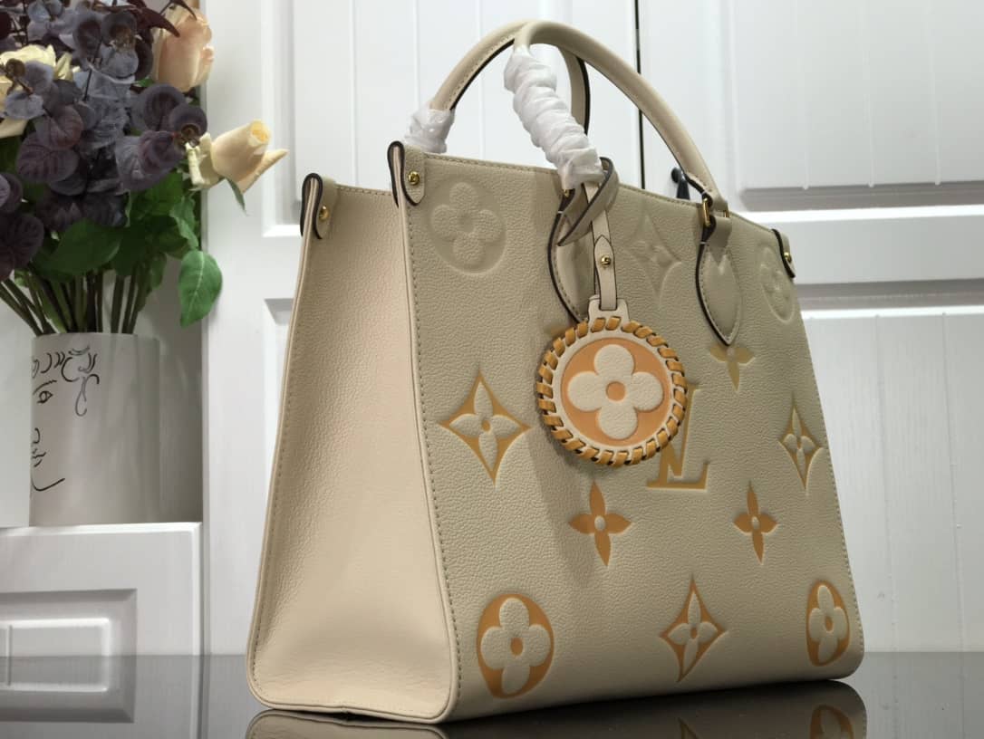 Louis Vuitton On the Go MM Monogram Empreinte Two-way Tote Replica Apricot M45717 - DEEPREPS