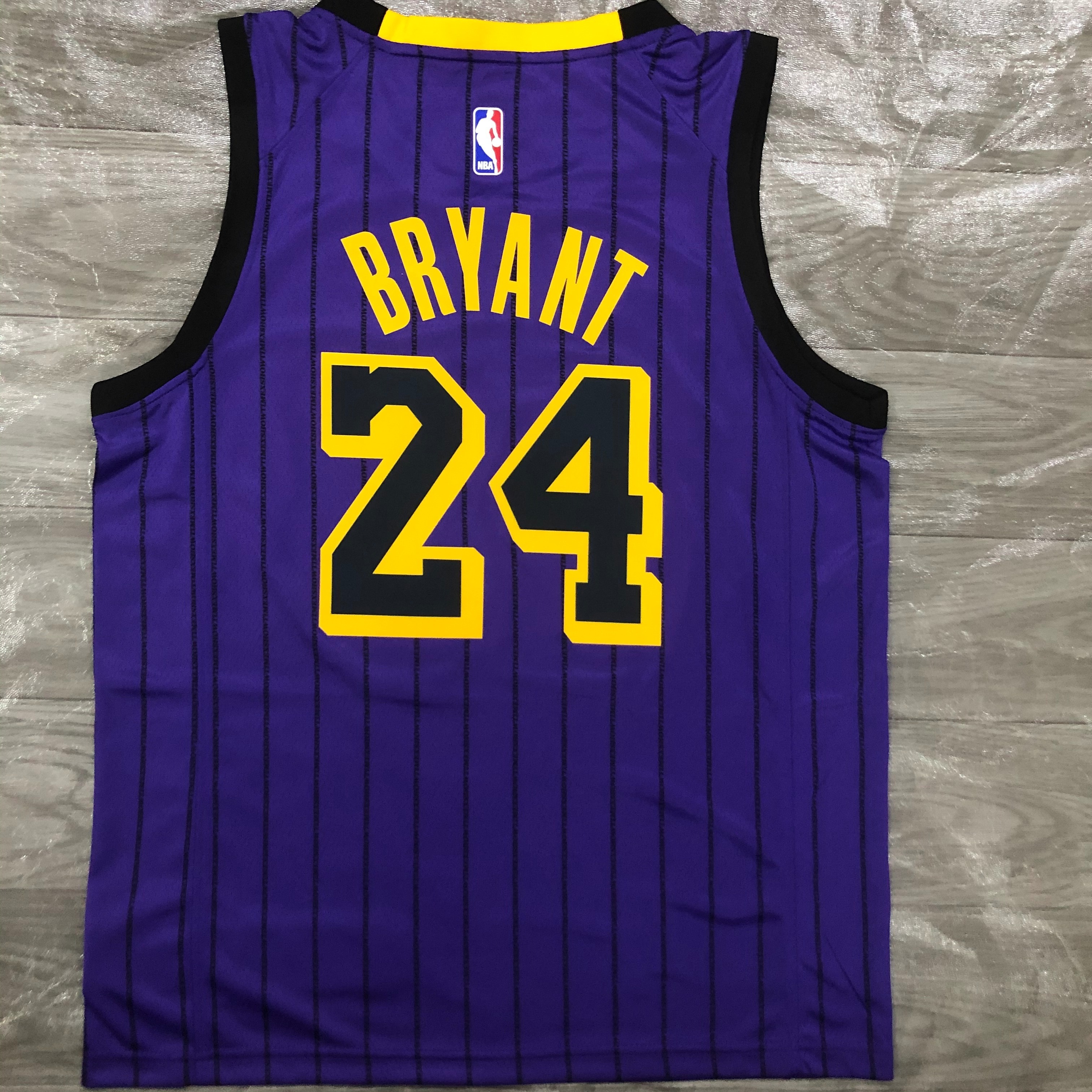 The Lakers' 18 purple stripes limited Kobe Bryant to No. 24