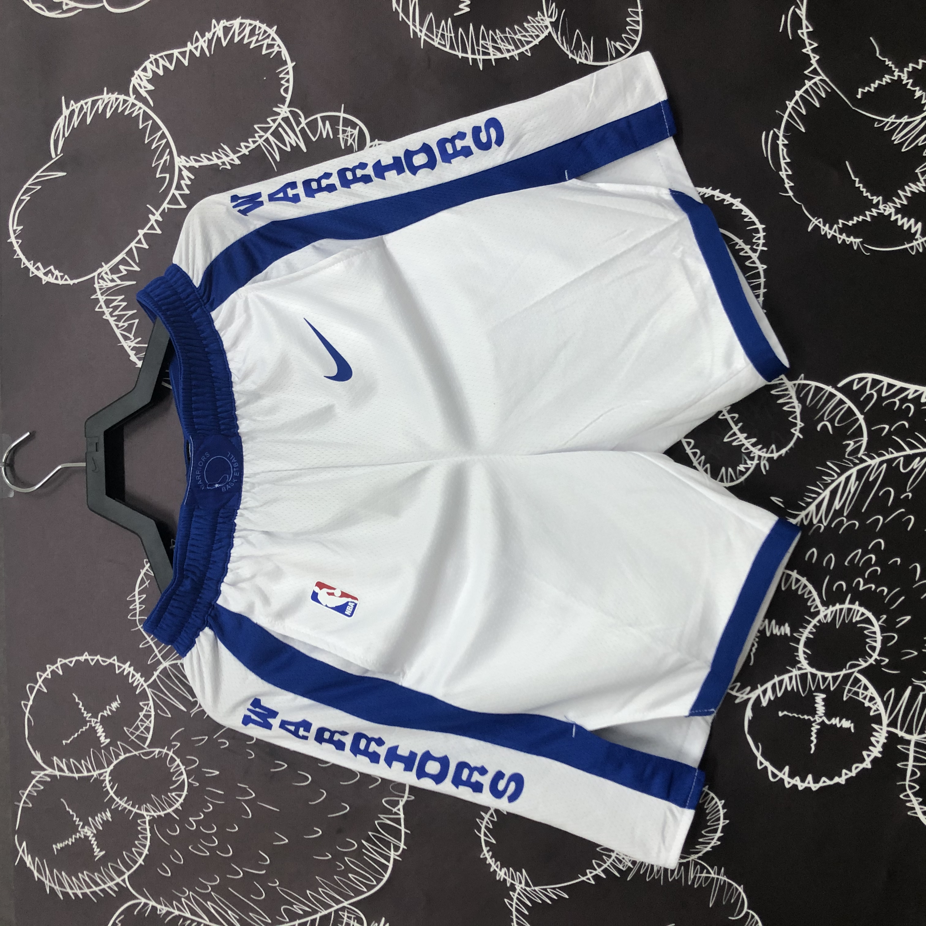 Warrior socks and white shorts