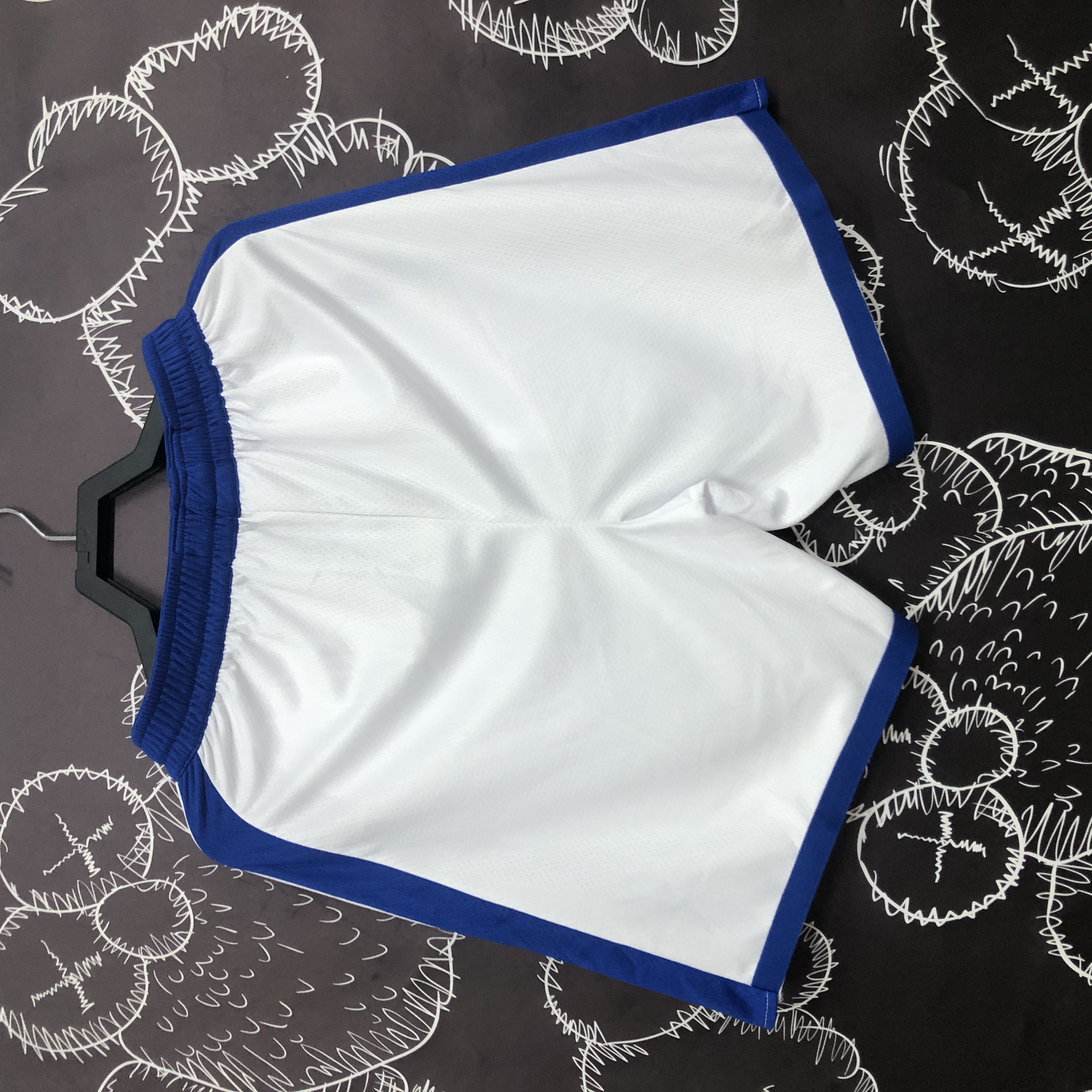 Warrior socks and white shorts