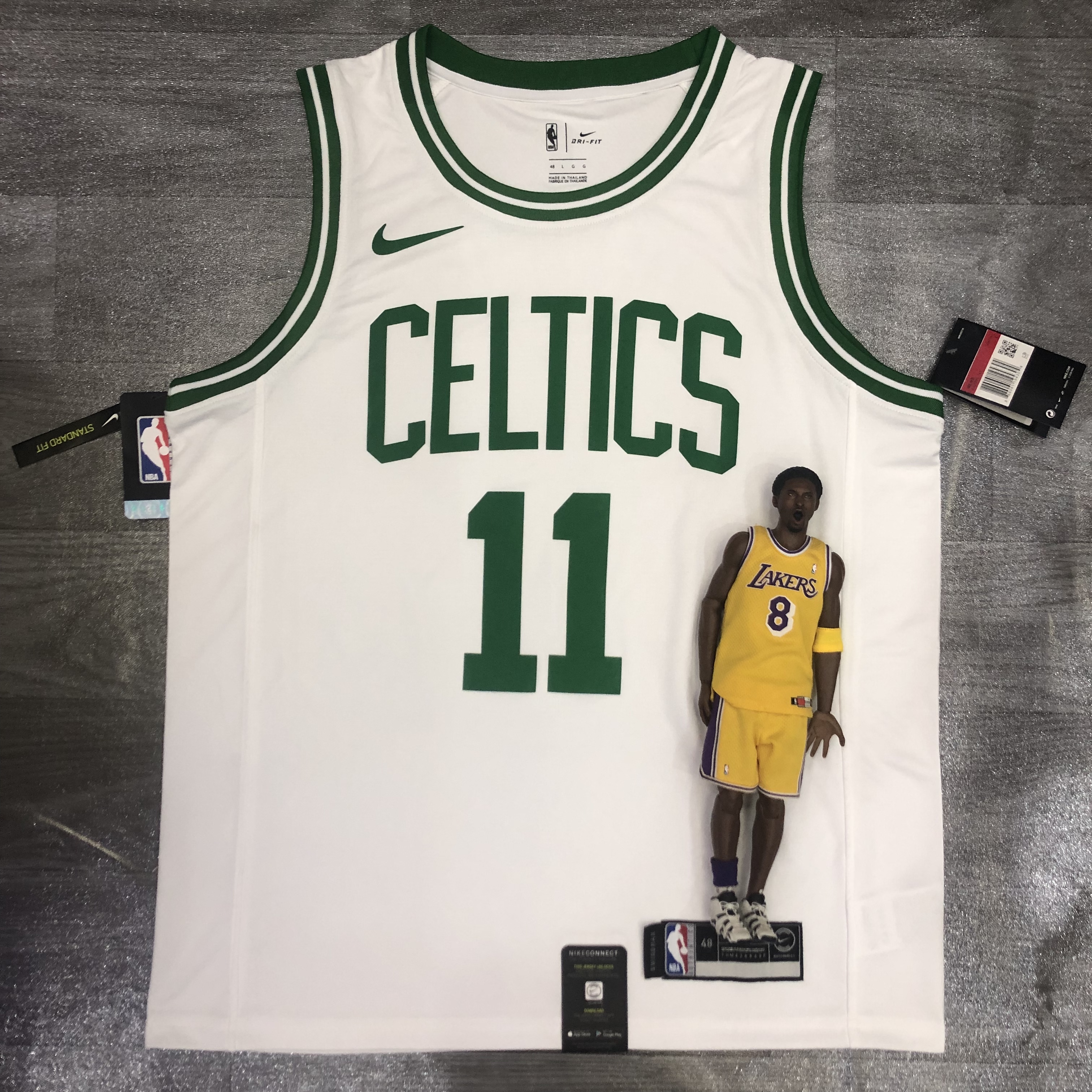 Celtics white number 11 Kyrie Irving