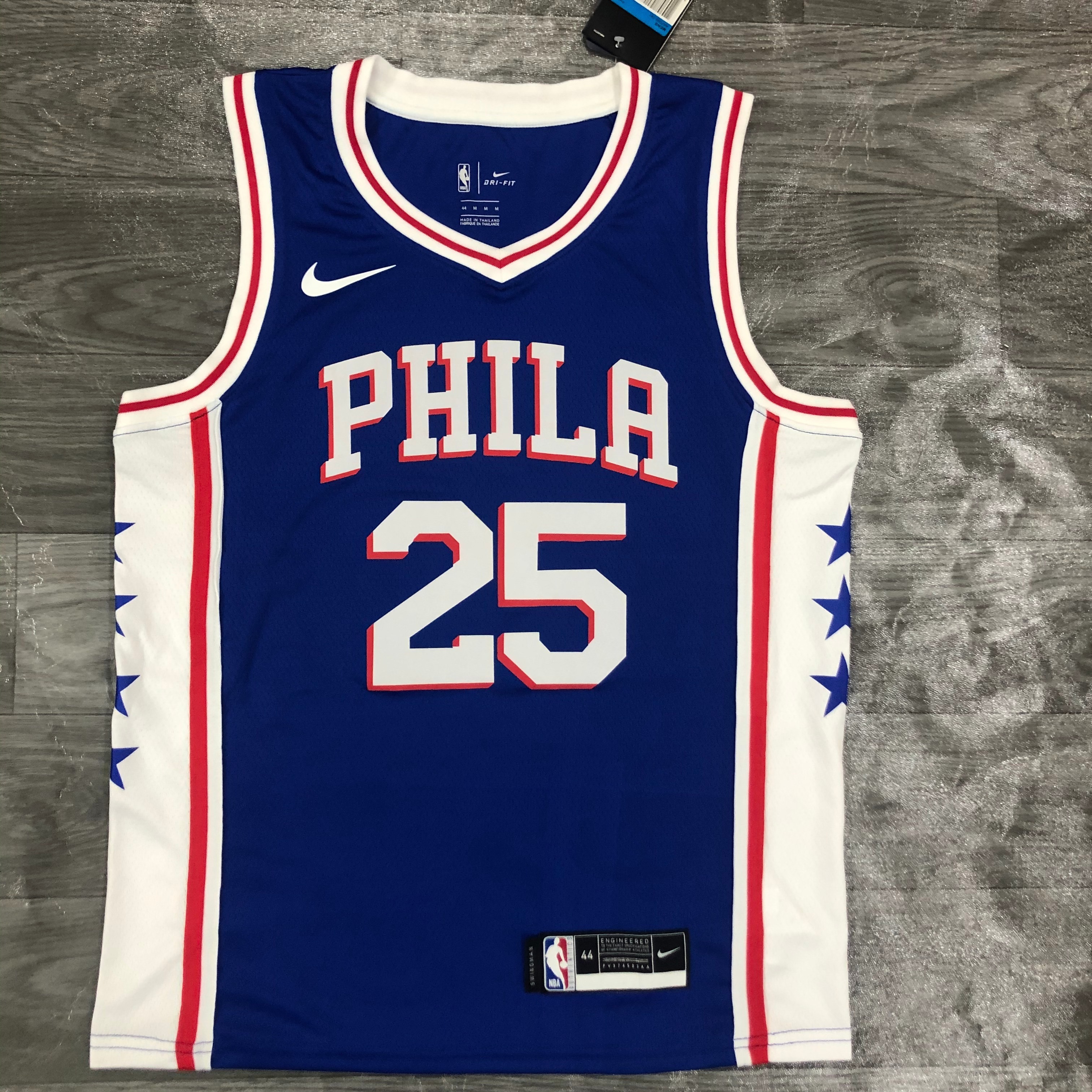 Sixers V-neck blue number 25. Simons