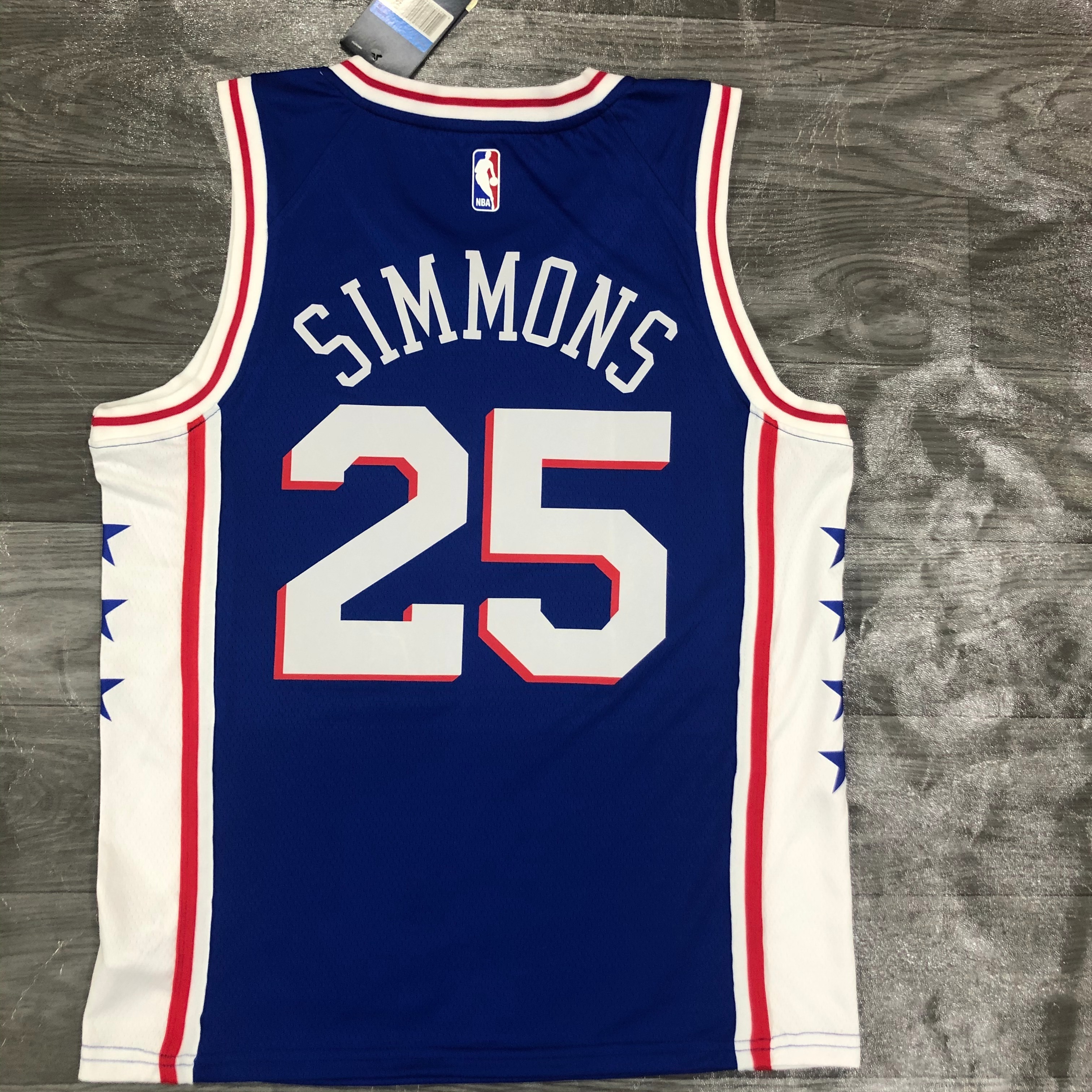 Sixers V-neck blue number 25. Simons