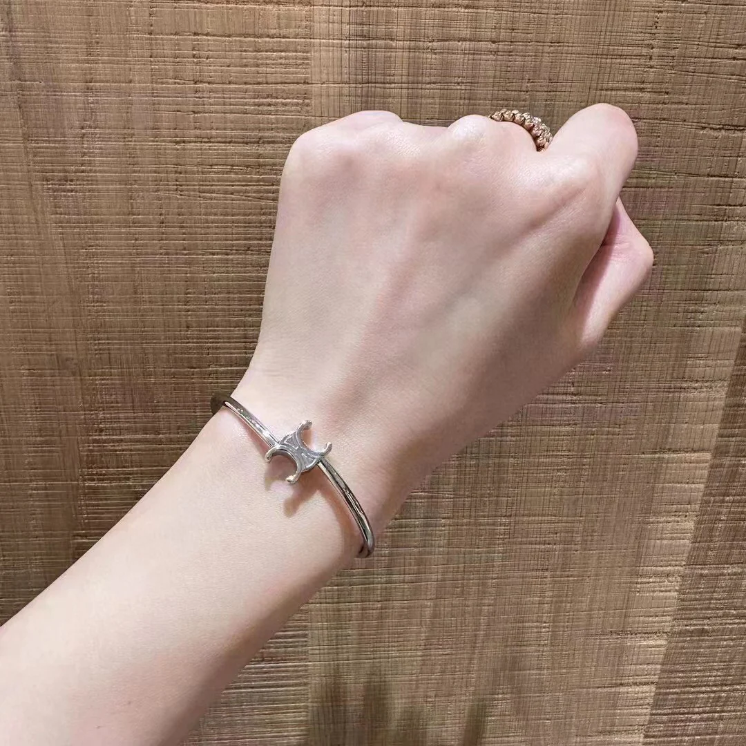 CLS004 Celine Triomphe Asymmetric Cuff in Brass with Gold Finish - ccjewelryacc