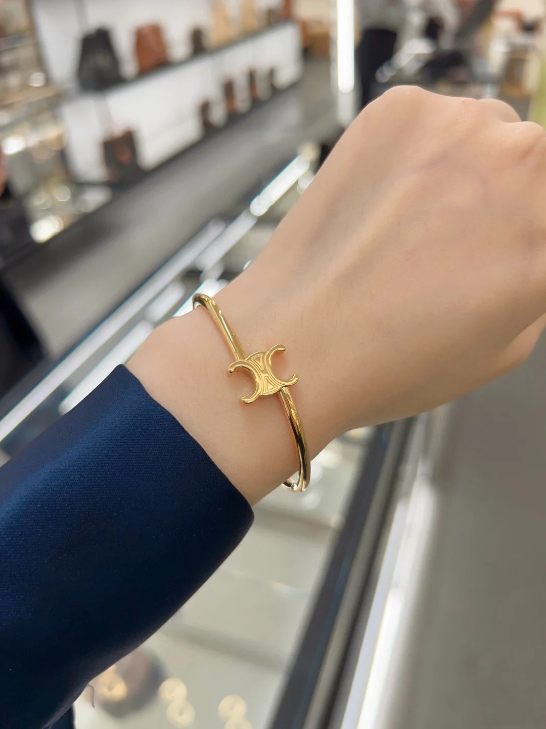 CLS004 Celine Triomphe Asymmetric Cuff in Brass with Gold Finish - ccjewelryacc