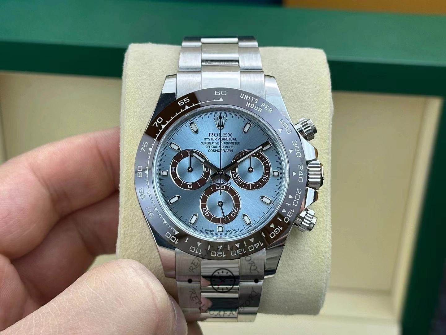 Front view of the Rolex Cosmograph Daytona 116506 with ice blue dial and brown ceramic bezel on cushion.