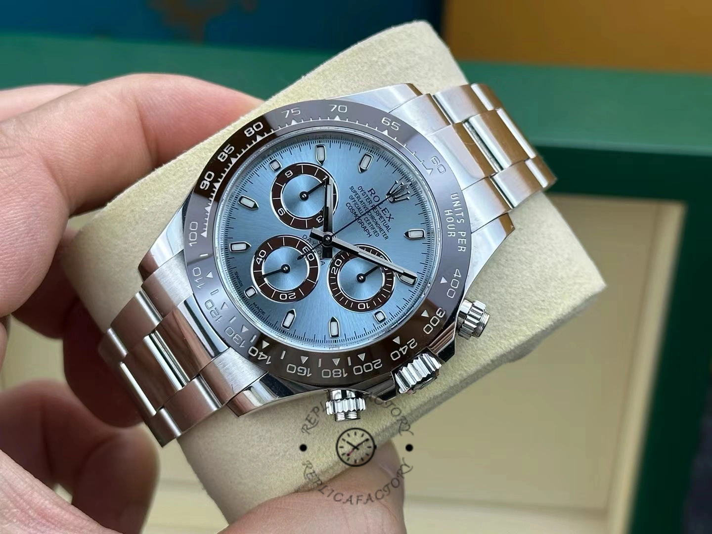 Manual angle view of the Rolex Daytona 116506 showing the ice blue dial and platinum bracelet.