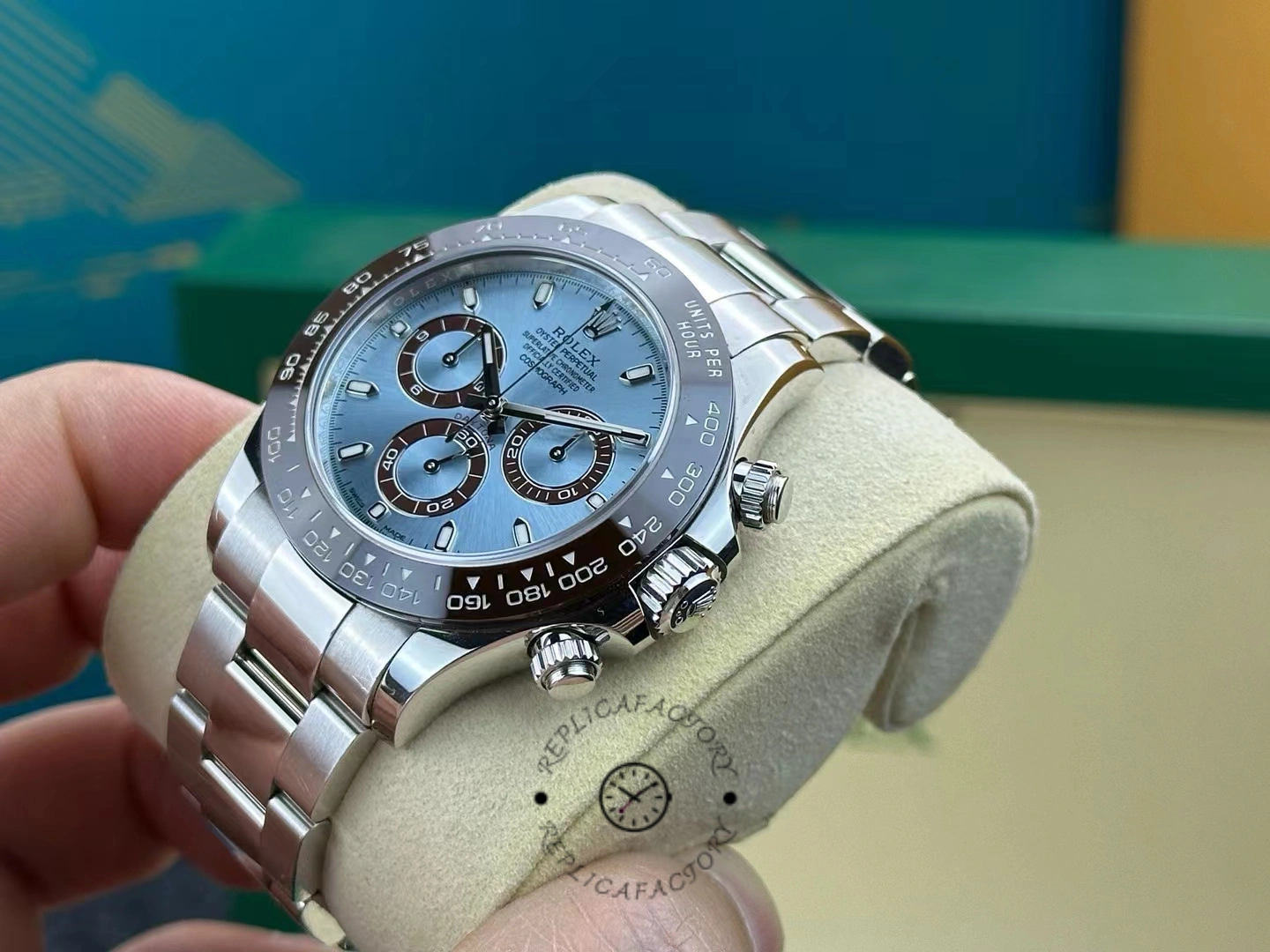 Lateral angle view of the Rolex Daytona 116506 highlighting the brown bezel and chronograph pushers.