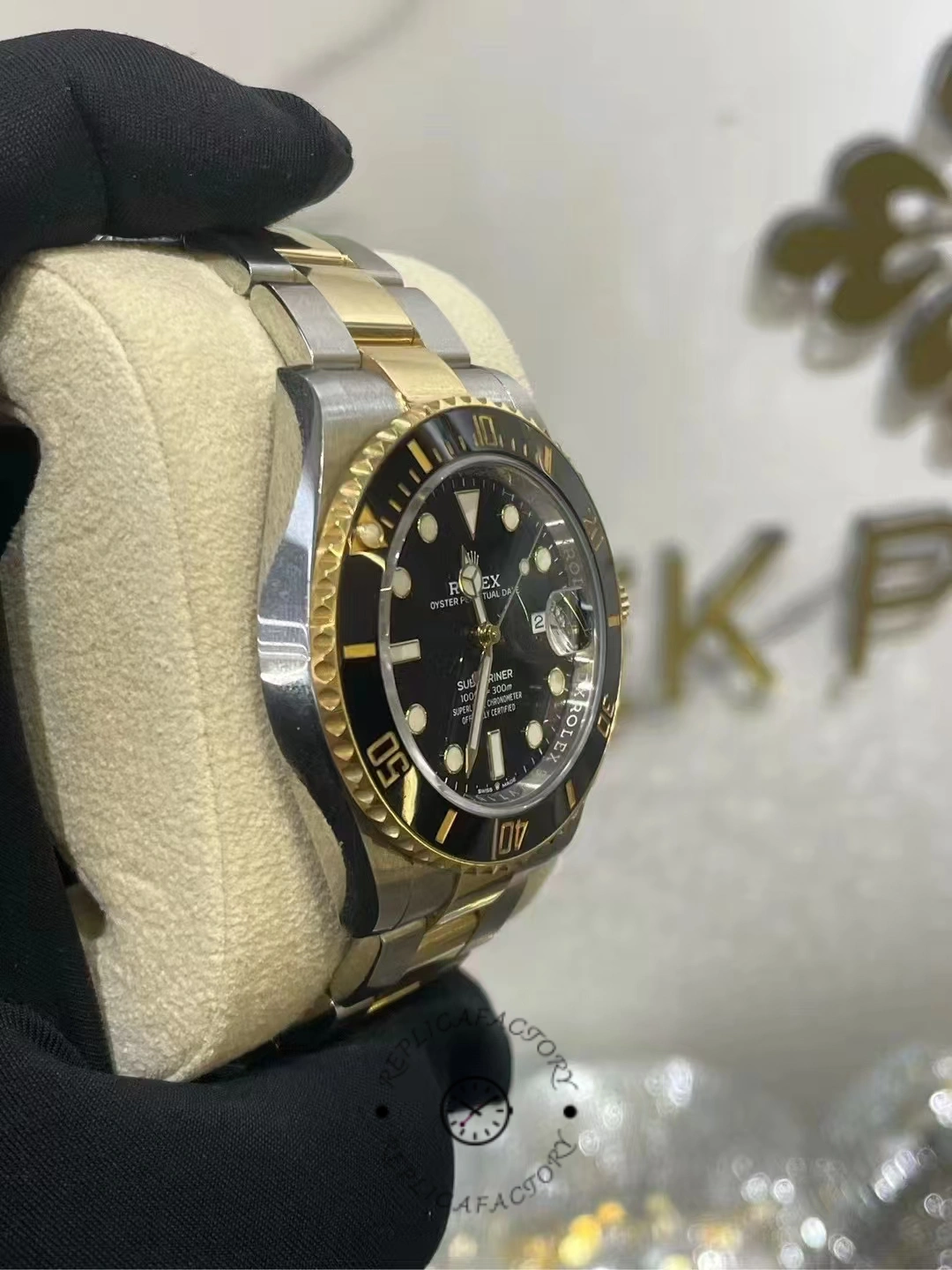 Angled side photo of a two-tone Rolex Submariner 126613LN-0002 after two years of use, showing the case and bracelet.