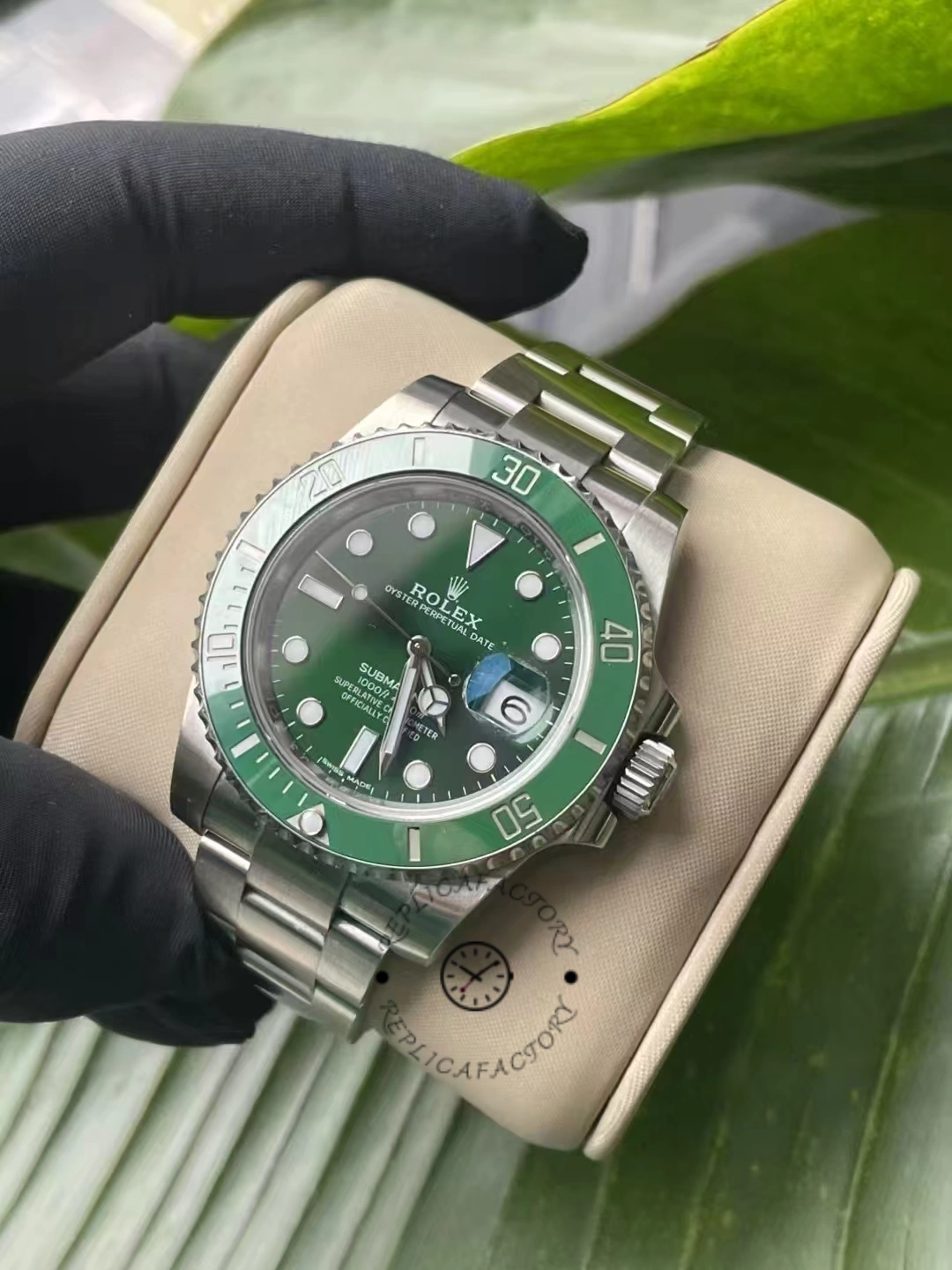 Angled view of the Rolex Submariner Date 116610LV showing the stainless steel bracelet and green ceramic bezel.