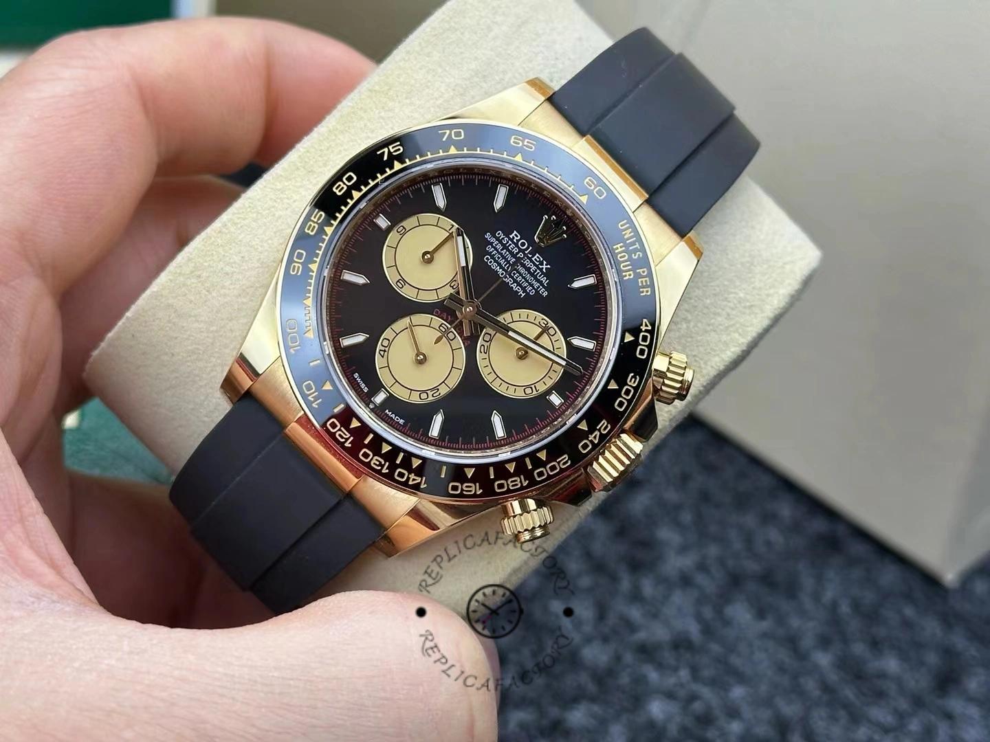 Manual angle shot of the Rolex Daytona 126518LN highlighting the gold case and Oysterflex strap.