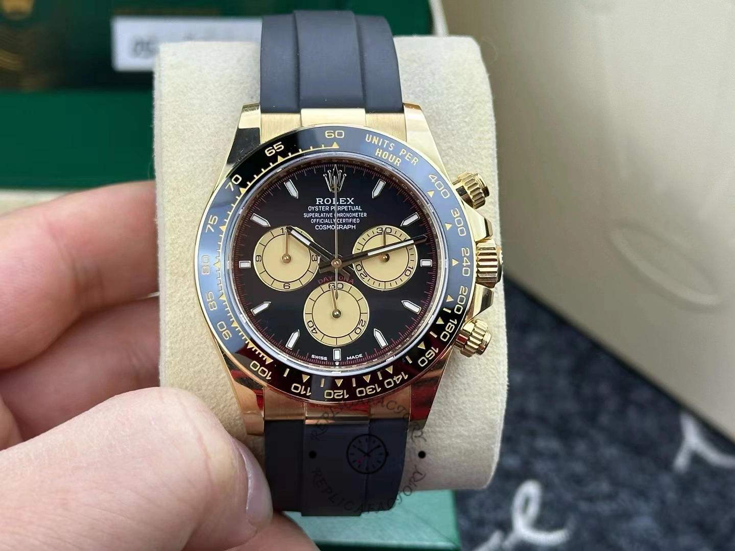 Real photo of the 40mm Rolex Cosmograph Daytona 126518LN with champagne-colored subdials and black ceramic bezel.