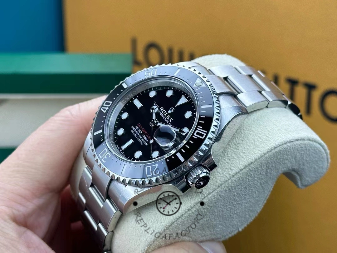 Side profile of the Rolex Sea-Dweller 126600-0002 with visible crown and rotating ceramic bezel.  width=