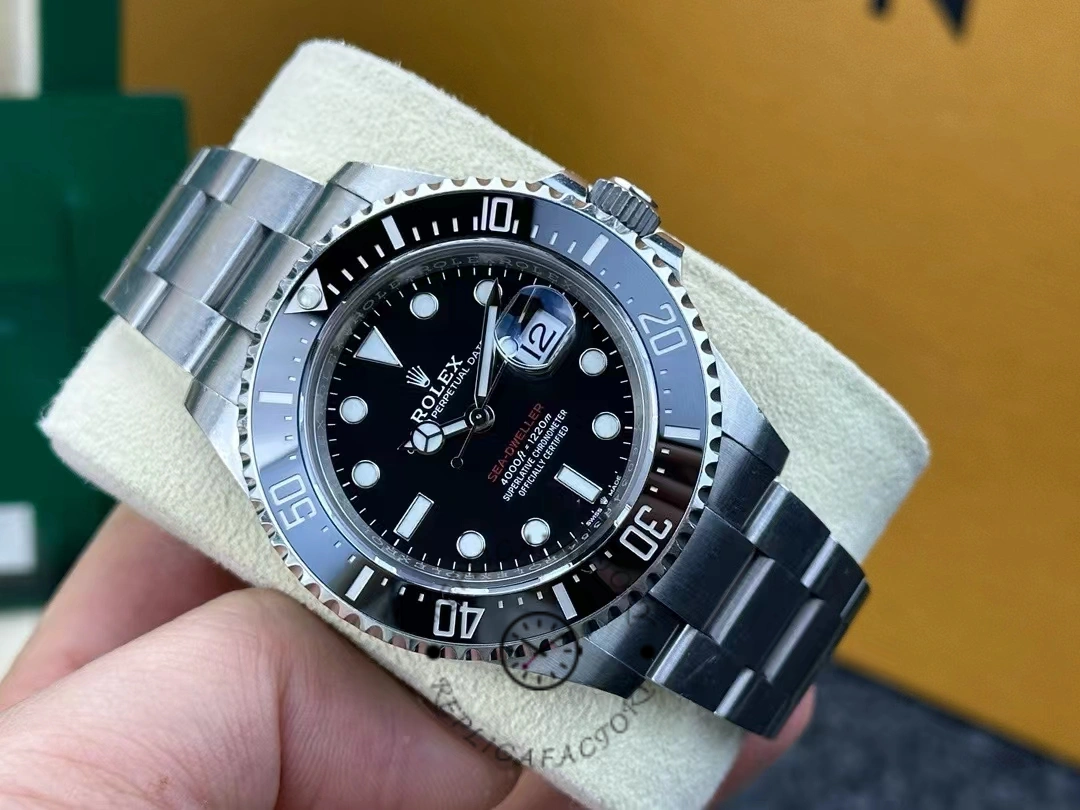 Rolex Sea-Dweller 126600-0002 resting on a cushion, showing a flawless black dial and a 43mm case.