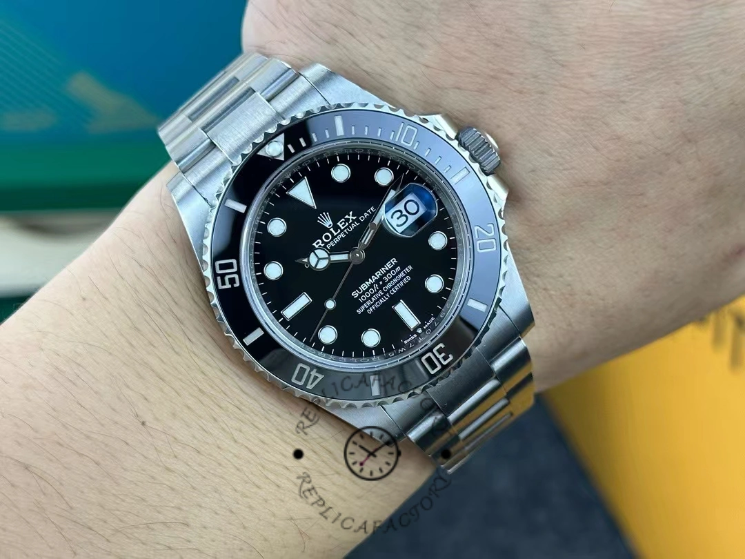 View of the Rolex Submariner 126610LN on a wrist, showing the entire dial and bracelet.