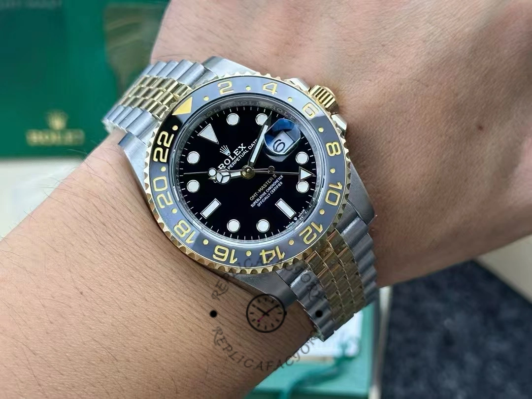 Rolex GMT-Master II 126713GRNR-0001 wrist photo showing a two-tone steel and gold case.
