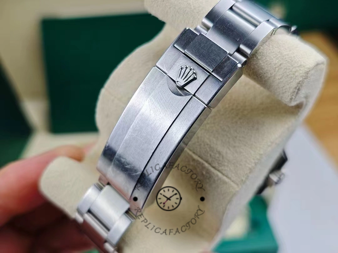 View of the closure of the Rolex Submariner Date 126610LN with the Rolex crown logo on the bracelet closure.
