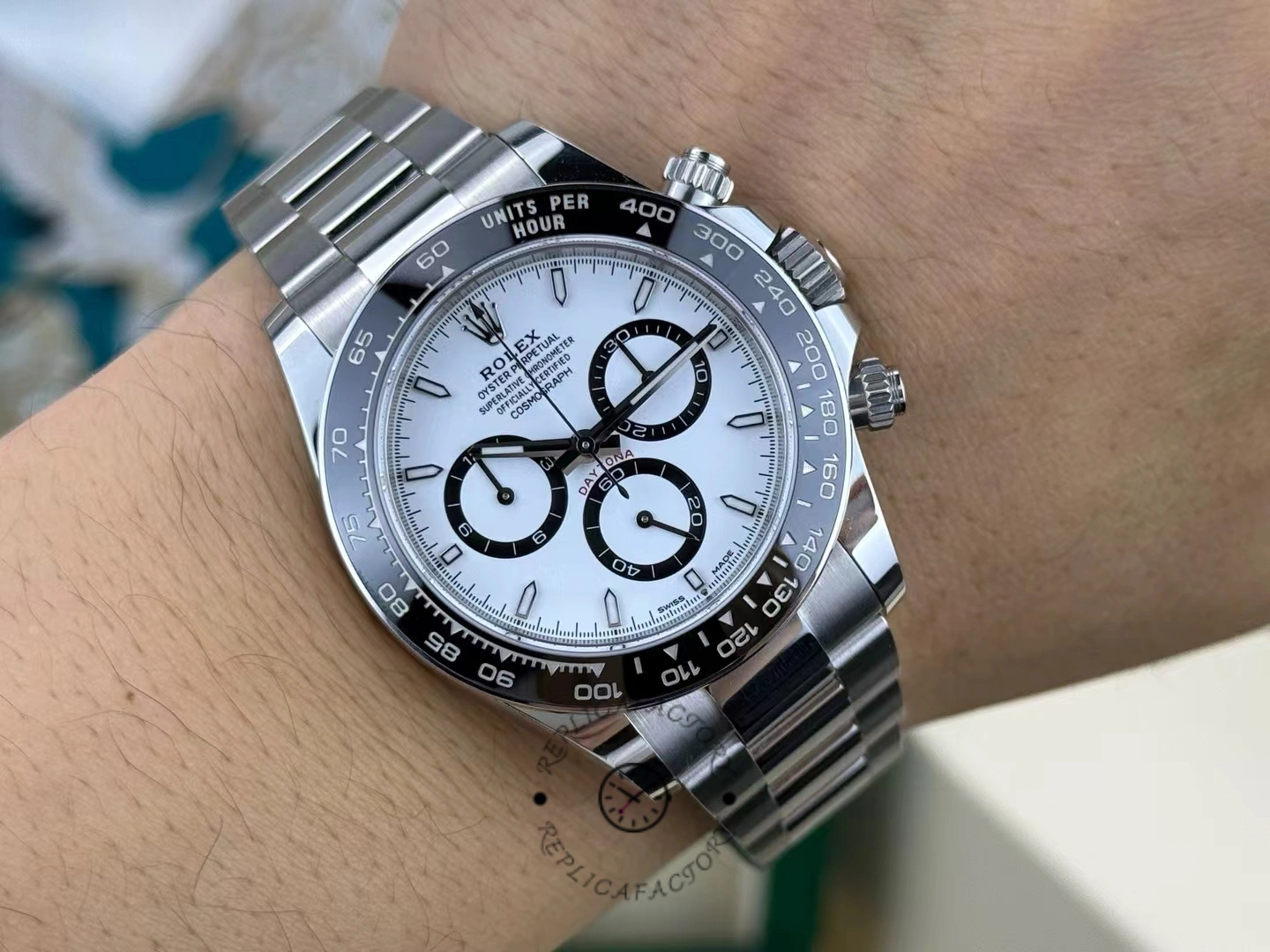 Photograph of the Rolex Cosmograph Daytona 116500LN on the wrist after one year of use, showing the watch on the wrist with polished handles