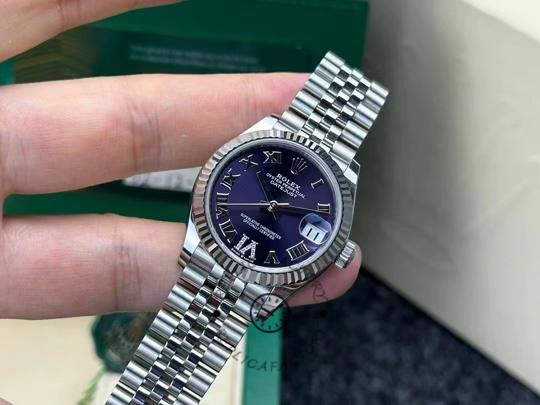 Front shot of a 31mm Rolex Datejust 278274-0018 worn for two years showing the clarity of the dial and the fluted bezel still in excellent condition